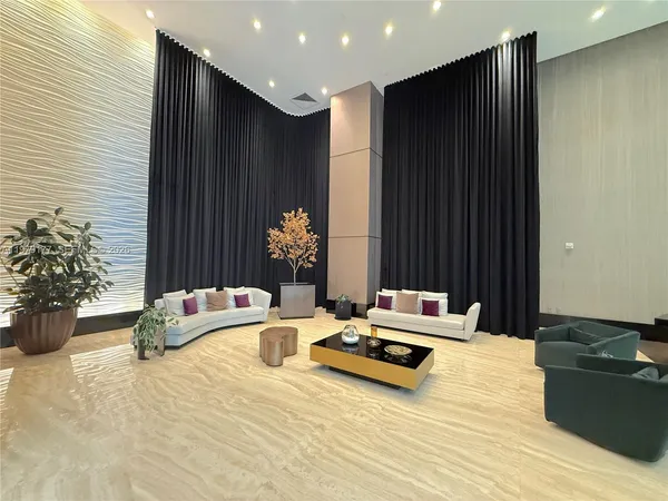 a bedroom with a bed and a potted plant