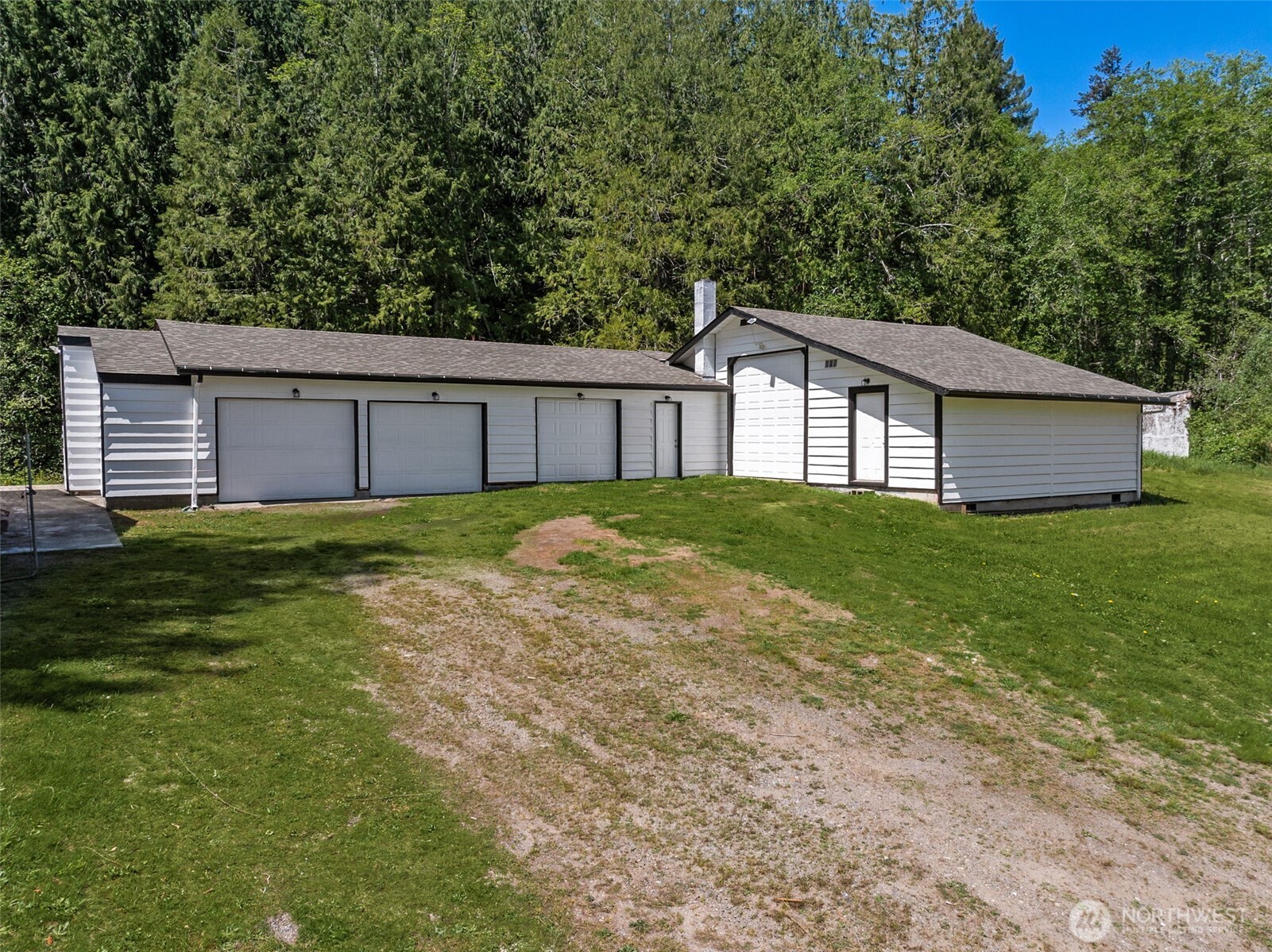 13710 Madrona Road Southwest Port Orchard, WA 98367 - Photo 2 of 40 a view of a house with a yard and a large tree