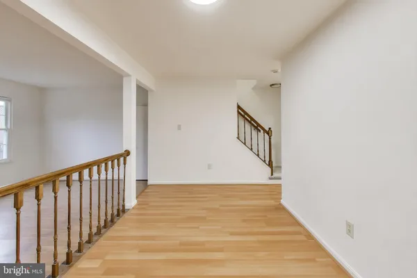 a view of a hallway view with staircase