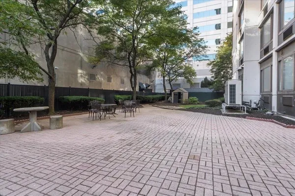 a backyard of a house with yard and outdoor seating