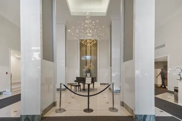 a view of a bathroom with mirror and furniture