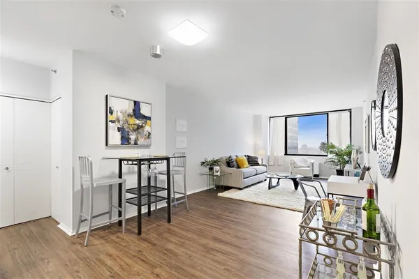 a bathroom with a granite countertop sink mirror toilet and bathtub