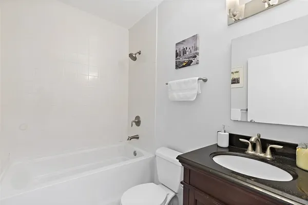 a kitchen with stainless steel appliances granite countertop a refrigerator sink and cabinets