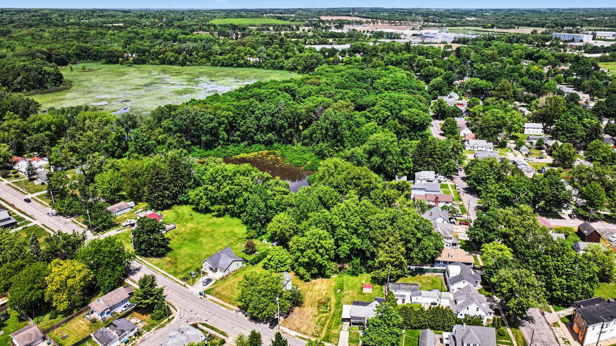 115 McClung Road La Porte, IN 46350 - Photo 27 of 31 an aerial view of residential houses with outdoor space and trees