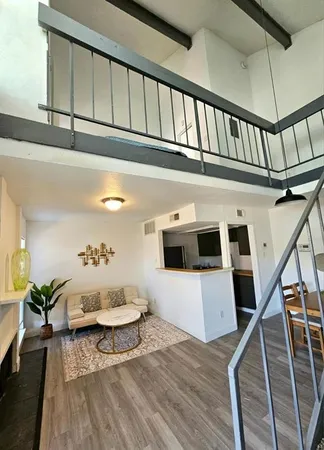a living room with furniture and a rug