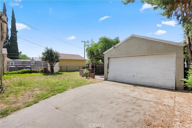 a view of a house with a yard and garage