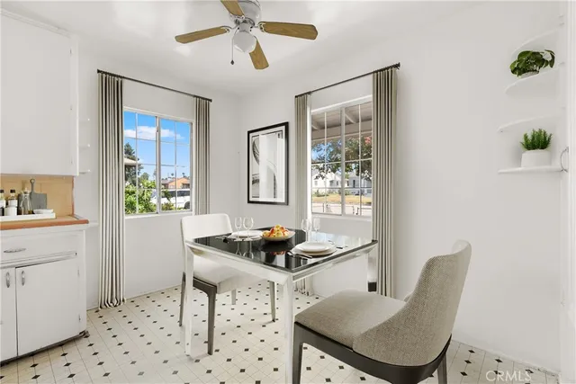 a dining room with furniture and window