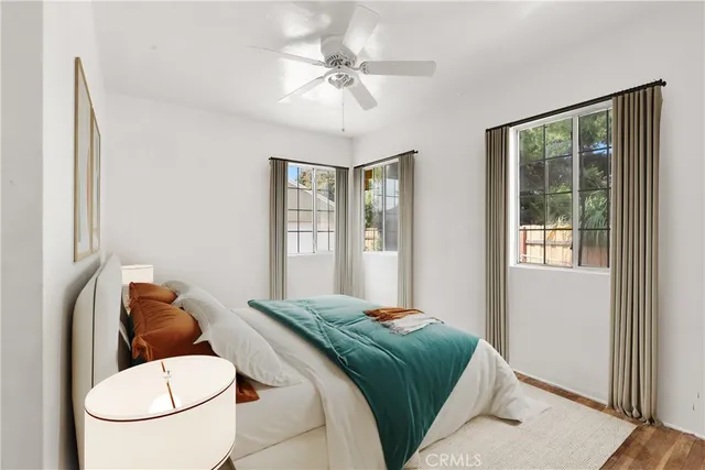 a bedroom with a bed and window