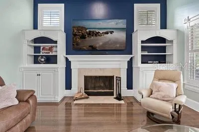 a kitchen with kitchen island granite countertop a sink cabinets and stainless steel appliances