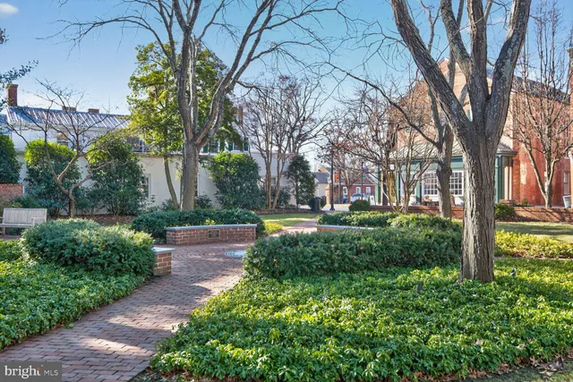 a view of brick house with large windows