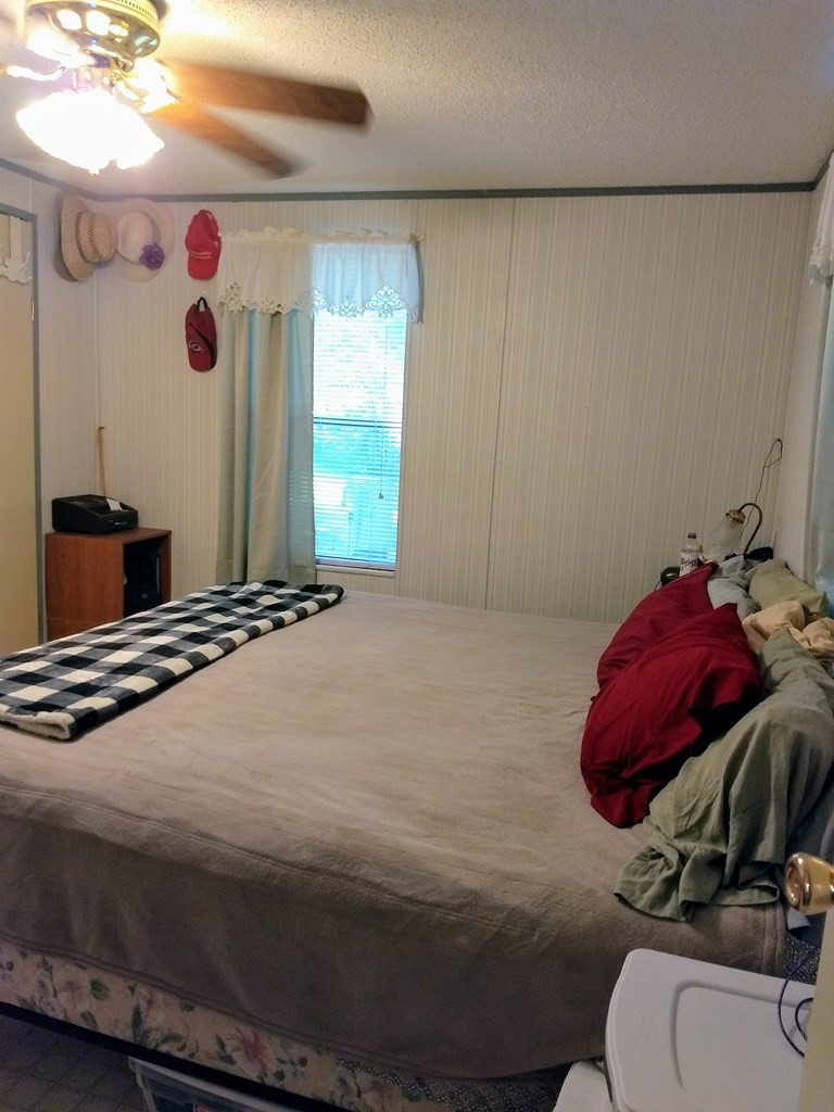 136 Redbud Lane Saluda, SC 29138 - Photo 5 of 17 a bedroom with a bed and a dresser