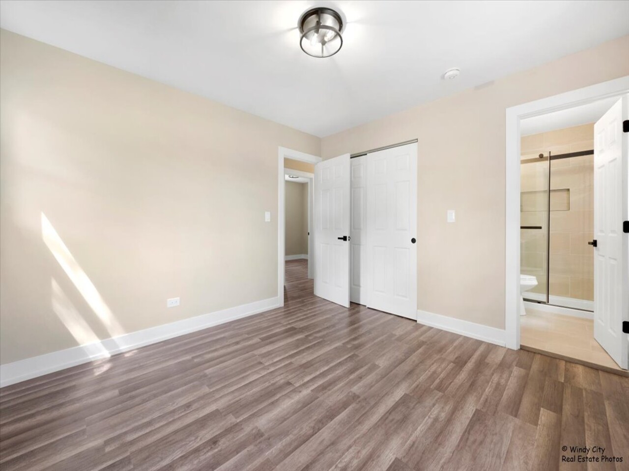 203 Elm Lane Streamwood, IL 60107 - Photo 11 of 23 an empty room with wooden floor and window