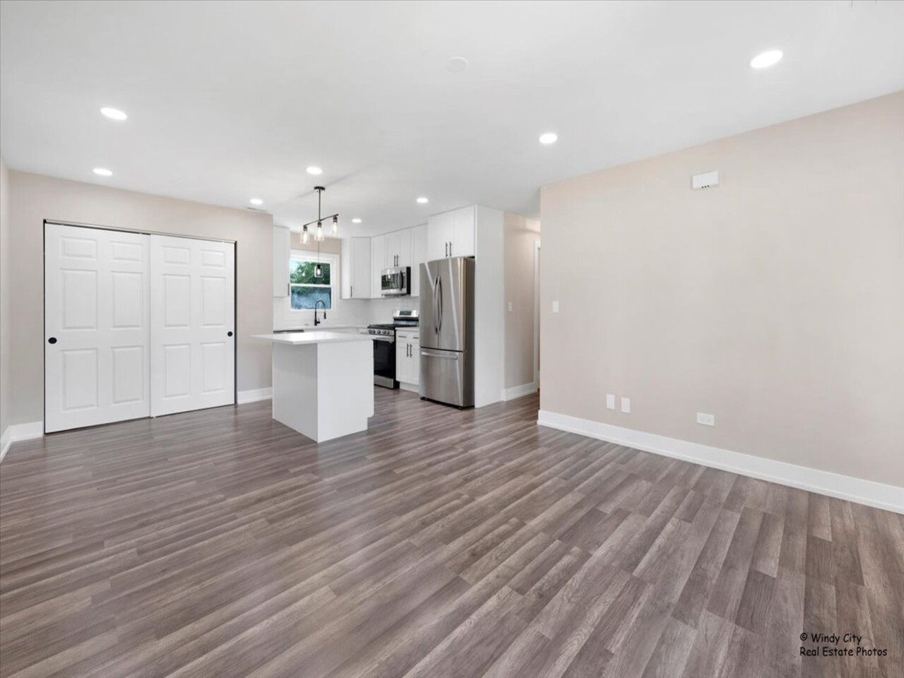 203 Elm Lane Streamwood, IL 60107 - Photo 3 of 23 a view of a kitchen with a refrigerator and a microwave