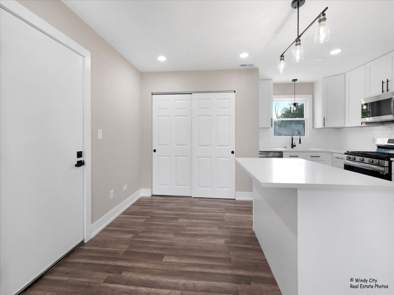 203 Elm Lane Streamwood, IL 60107 - Photo 7 of 23 a view of kitchen with sink and refrigerator