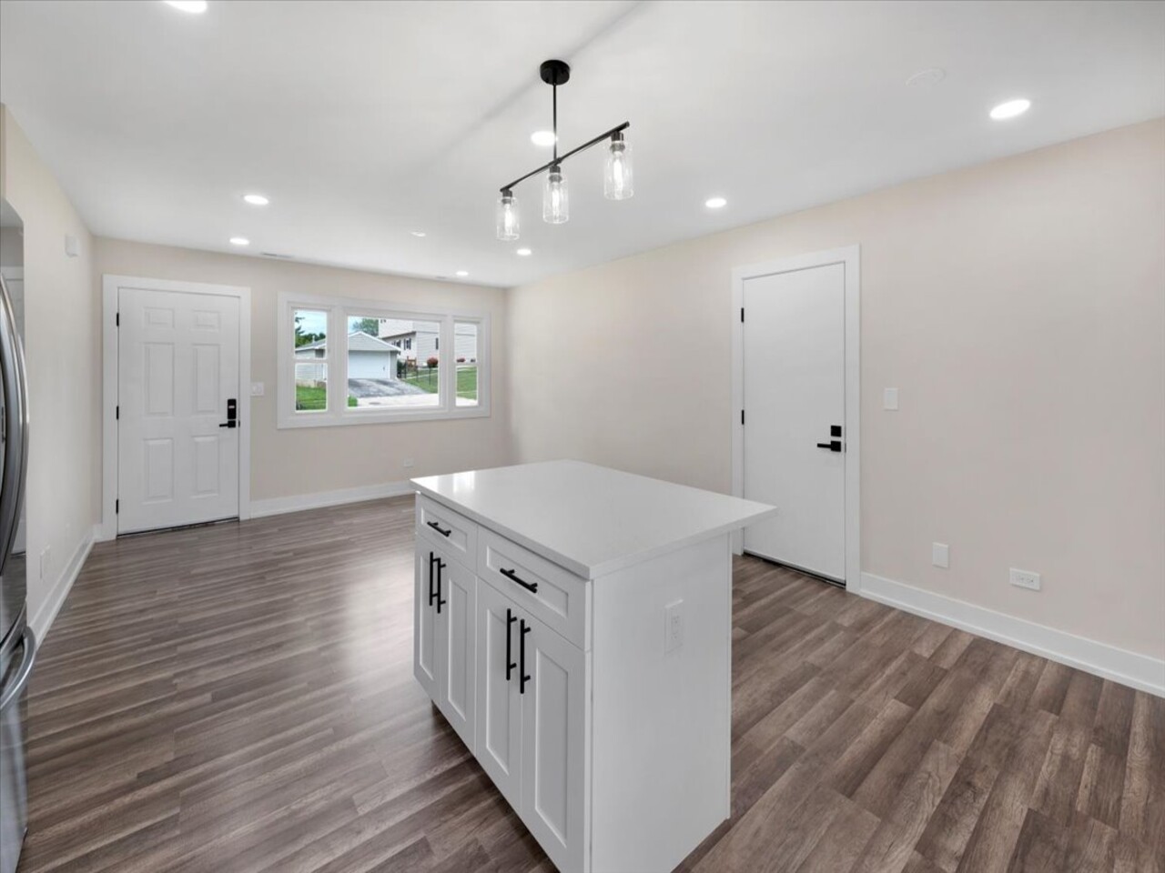 203 Elm Lane Streamwood, IL 60107 - Photo 9 of 23 a view of a hallway with wooden floor