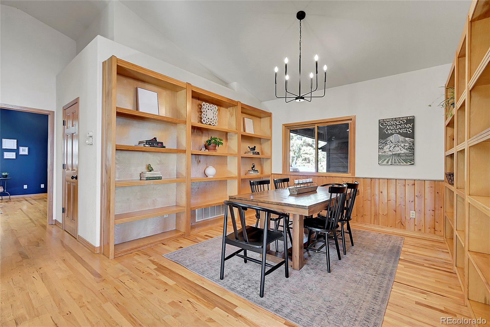 13382 Riley Peak Road Conifer, CO 80433 - Photo 11 of 25 a view of a dining room with furniture window and wooden floor