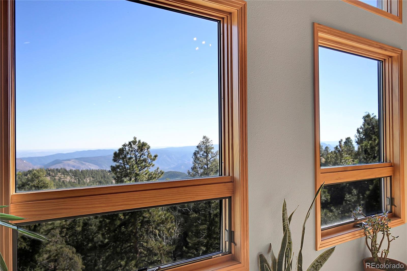 13382 Riley Peak Road Conifer, CO 80433 - Photo 8 of 25 a view of a glass door and a balcony