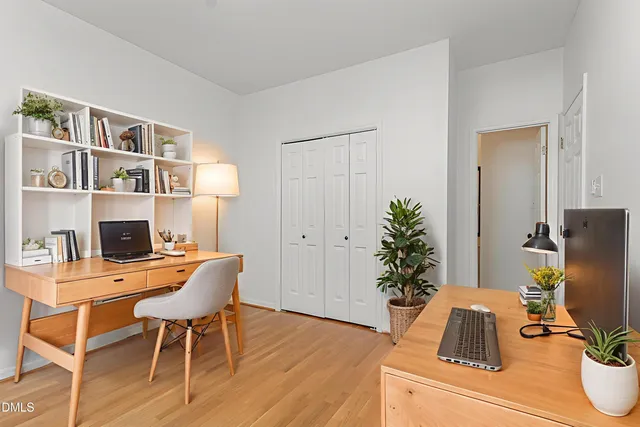 a workspace with furniture and a potted plant