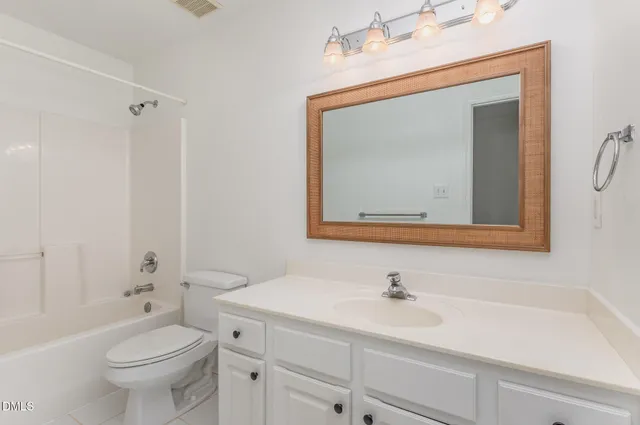 a bathroom with a toilet a sink and a bathtub