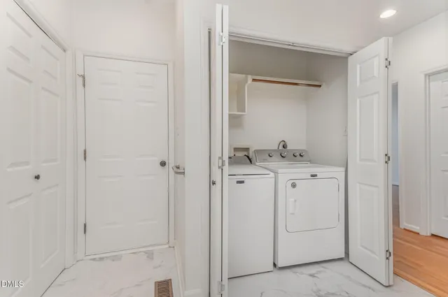 a bathroom with a granite countertop sink and shower