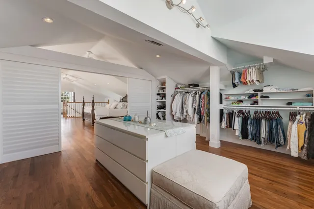 a view of a lake with boats and trees in the background