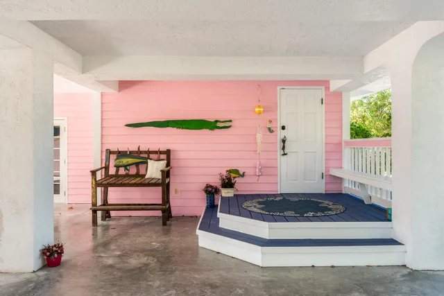 a living room with furniture rug and a flat screen tv