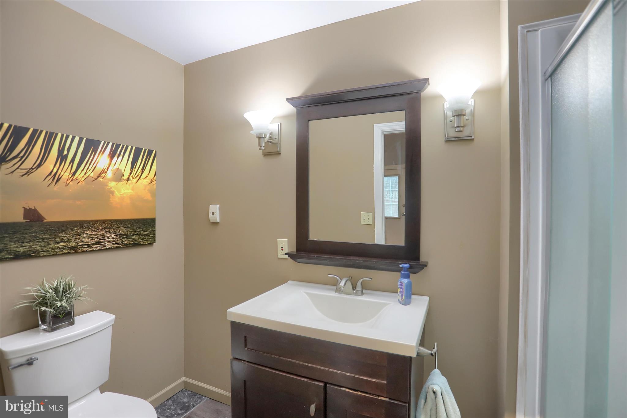 29 Arlene Street Harrisburg, PA 17112 - Photo 16 of 32 a bathroom with a toilet a sink and a mirror