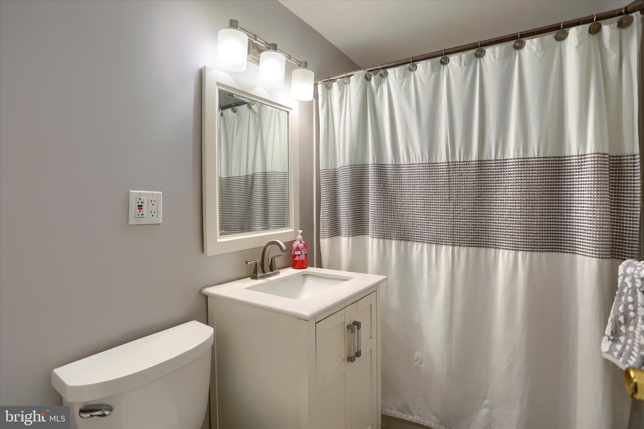 29 Arlene Street Harrisburg, PA 17112 - Photo 20 of 32 a bathroom with a sink a toilet and a mirror