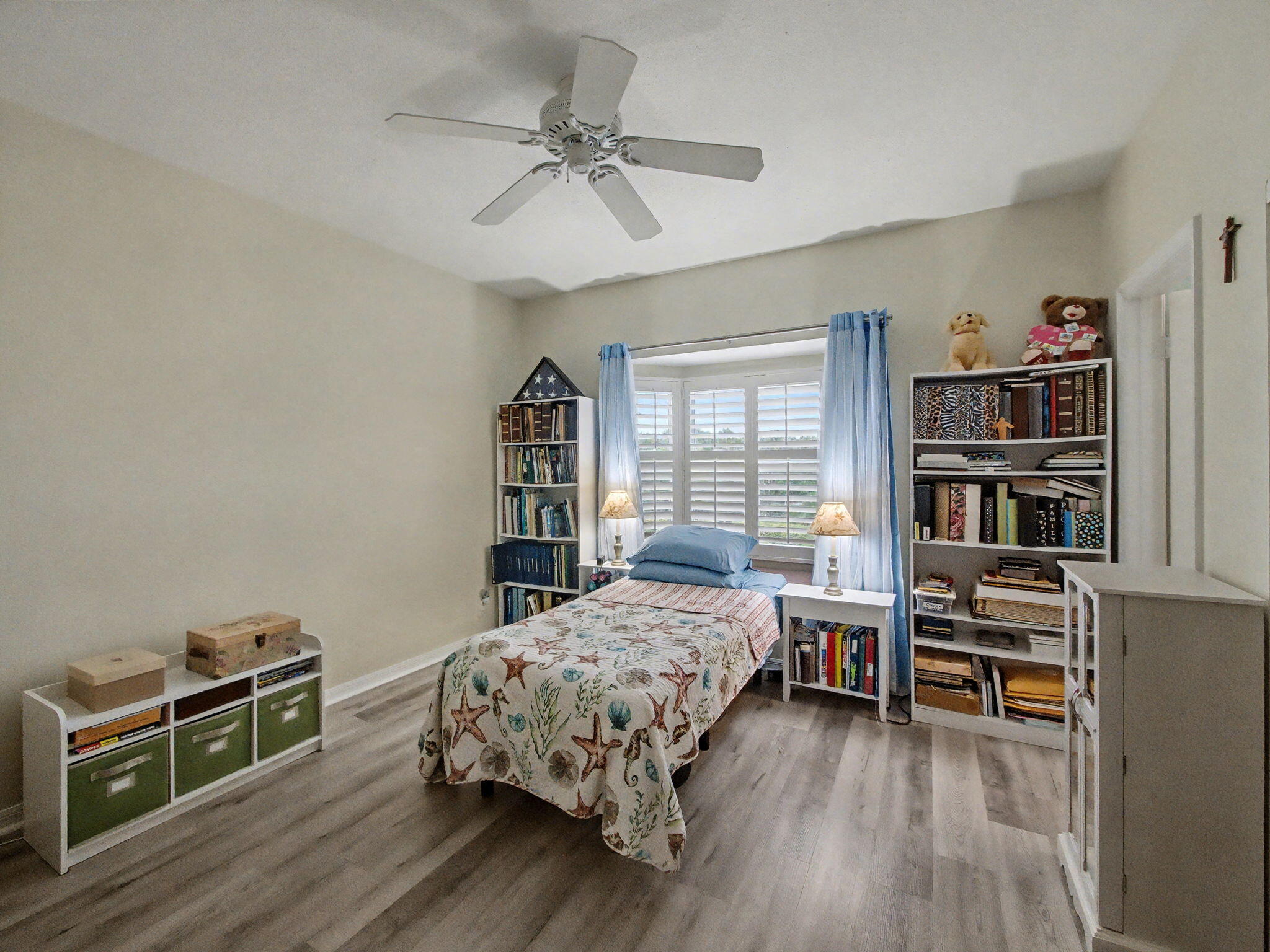 3012 Mainsail Circle Jupiter, FL 33477 - Photo 22 of 33 a bedroom with a bed bookshelf and a chair