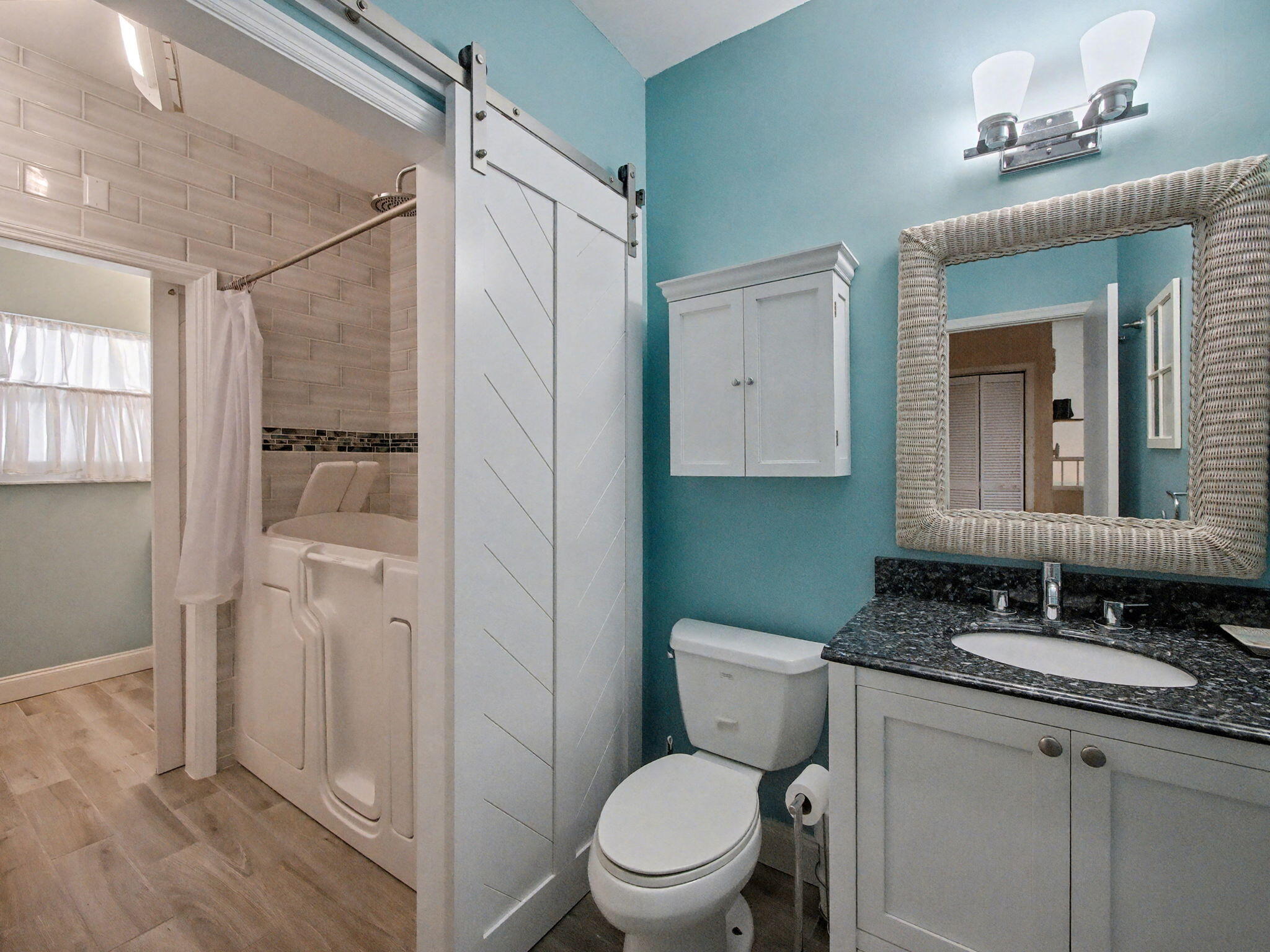 3012 Mainsail Circle Jupiter, FL 33477 - Photo 23 of 33 a bathroom with a granite countertop sink toilet and shower