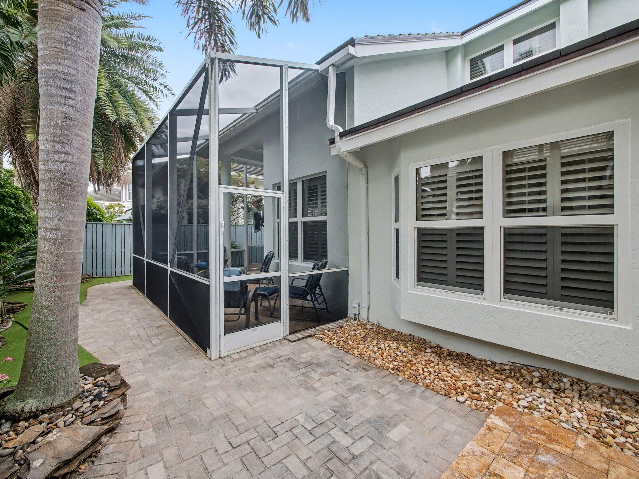 3012 Mainsail Circle Jupiter, FL 33477 - Photo 28 of 33 a view of a house with a large window and wooden fence