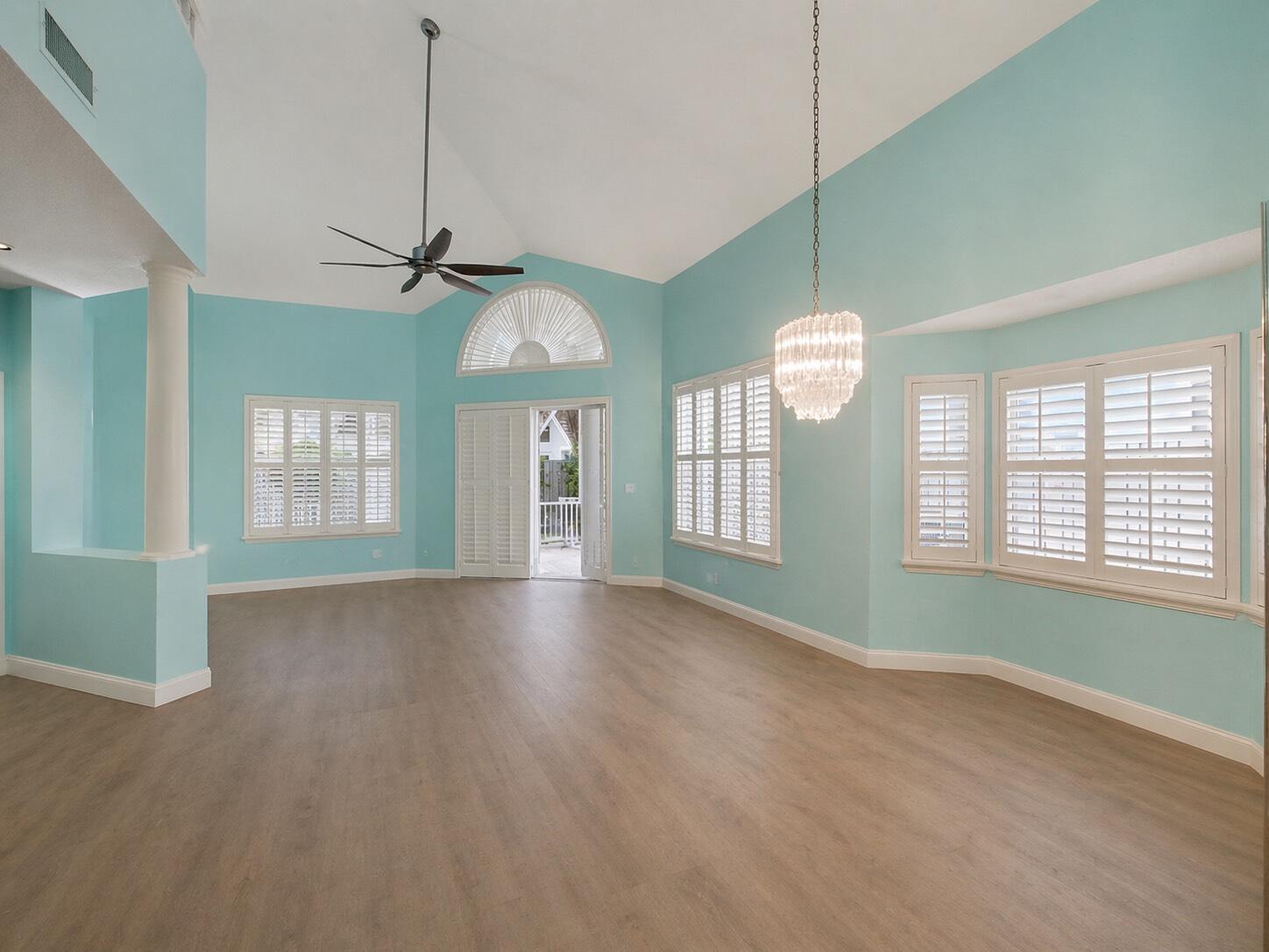 3012 Mainsail Circle Jupiter, FL 33477 - Photo 5 of 33 a view of an empty room with a window and wooden floor