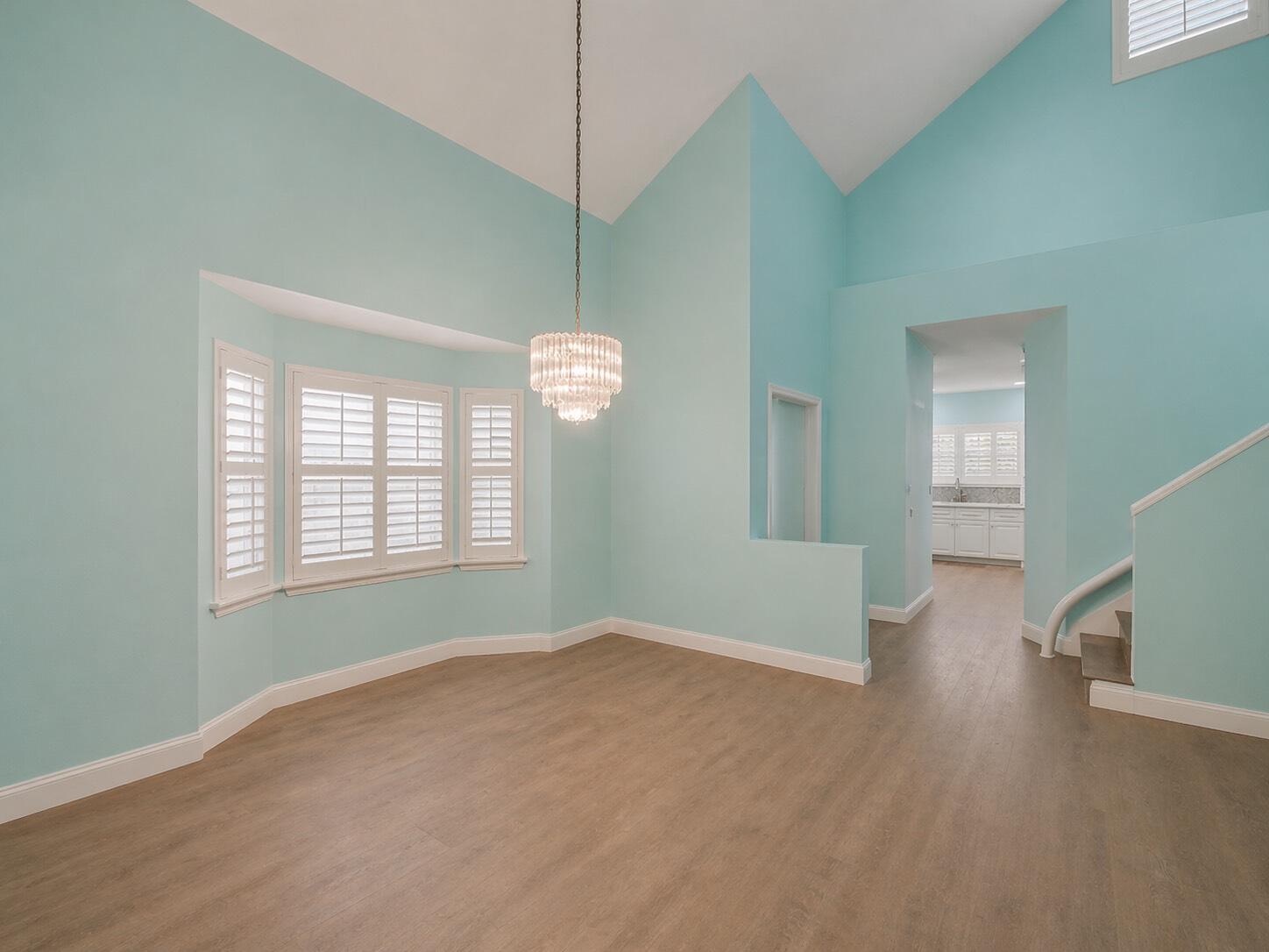 3012 Mainsail Circle Jupiter, FL 33477 - Photo 7 of 33 a view of an empty room with a window and wooden floor