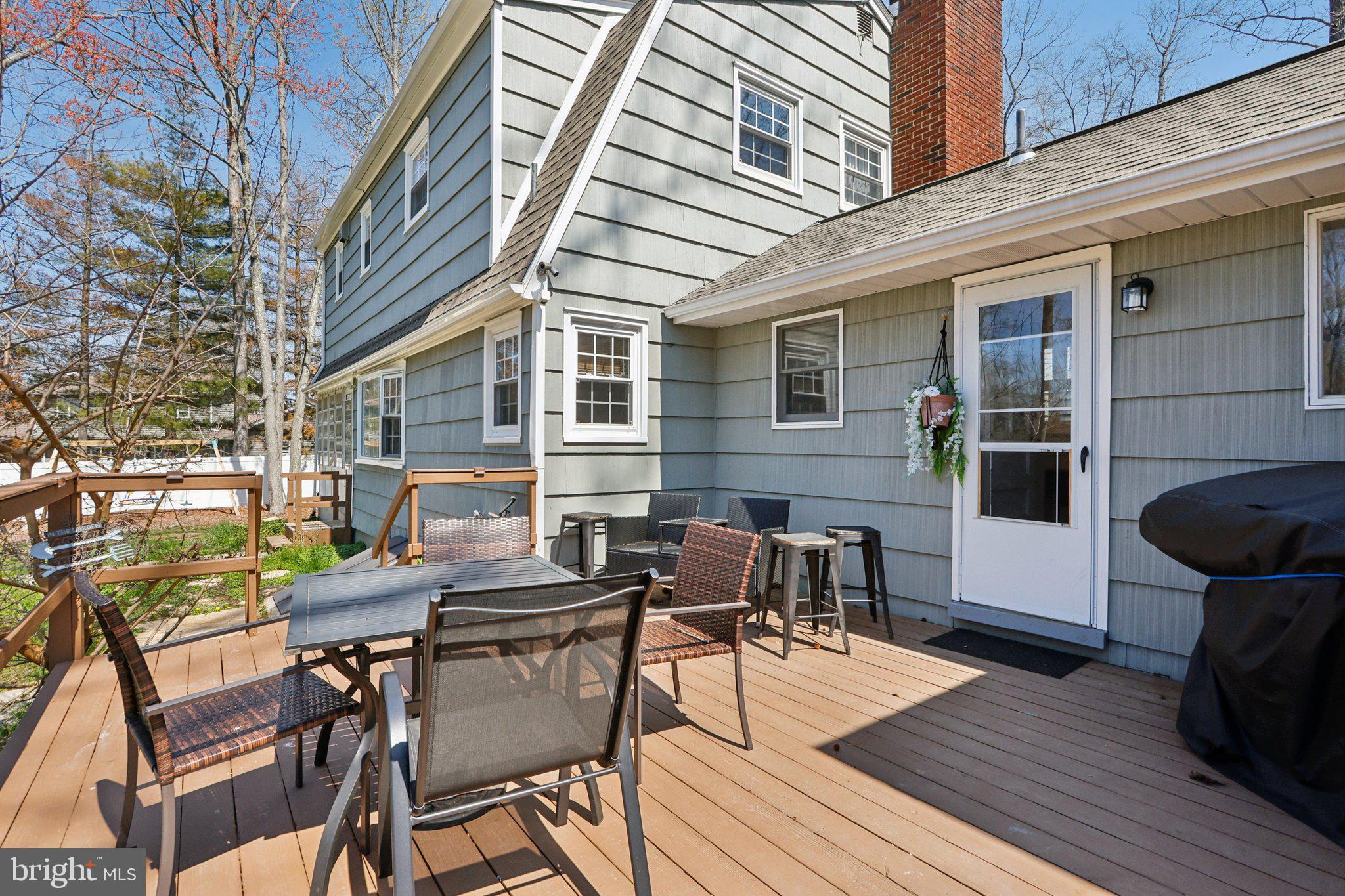 351 Merrick Road Robbinsville, NJ 08691 - Photo 47 of 69 a view of a patio with table and chairs and wooden floor