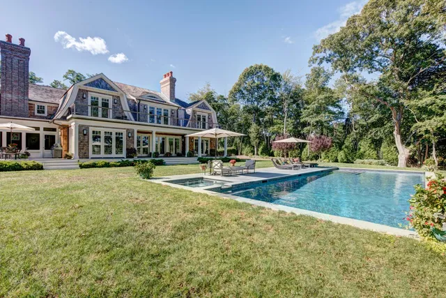a view of a swimming pool with an outdoor seating