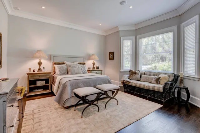 a bedroom with furniture and a window