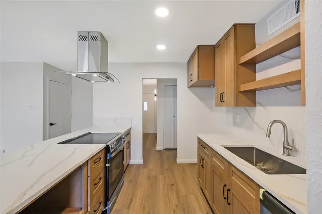 a kitchen with a sink and cabinets