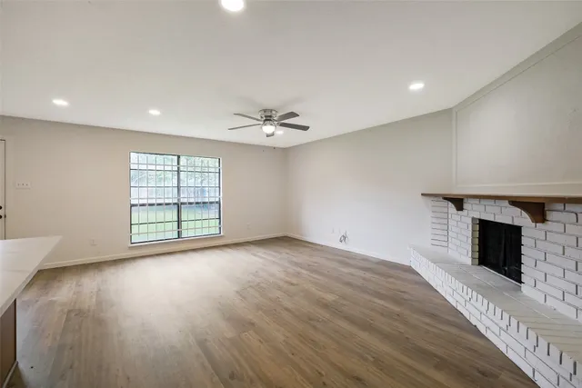 a view of a kitchen with a sink and a kitchen counter top space