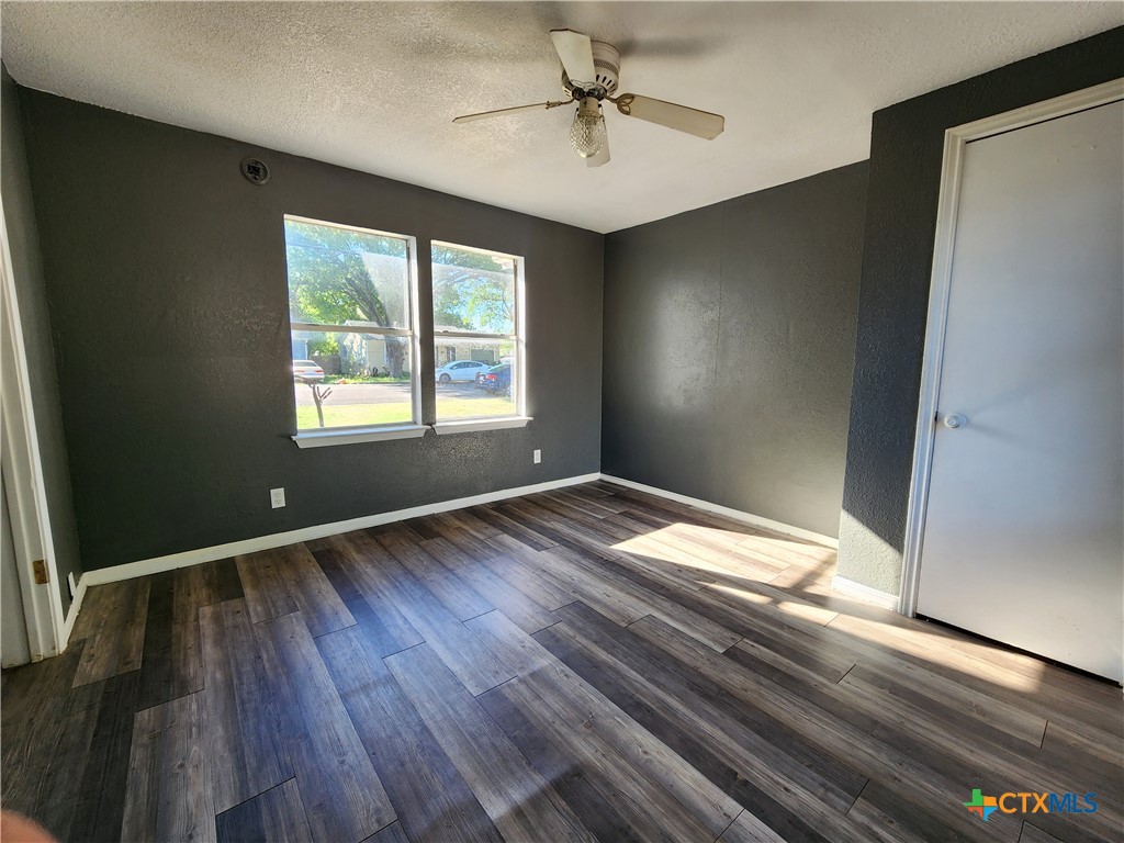 502 North 7th Street Copperas Cove, TX 76522 - Photo 15 of 22 a view of empty room with wooden floor and fan