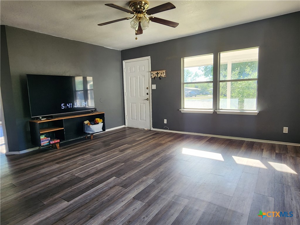 502 North 7th Street Copperas Cove, TX 76522 - Photo 5 of 22 a view of livingroom with hardwood floor and a ceiling fan