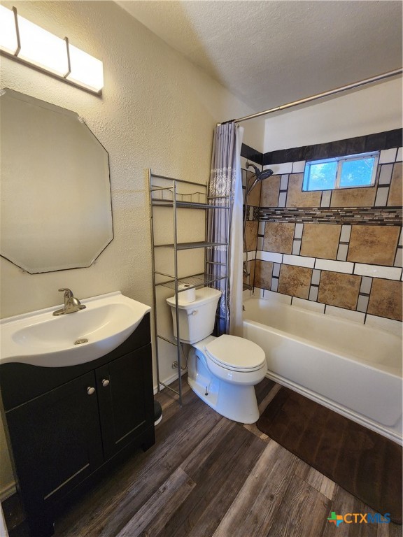 502 North 7th Street Copperas Cove, TX 76522 - Photo 8 of 22 a bathroom with a double vanity sink toilet and shower