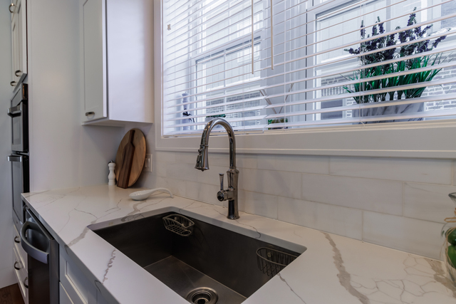 1746 West 104th Place Chicago, IL 60643 - Photo 17 of 58 a bathroom with a sink and a mirror