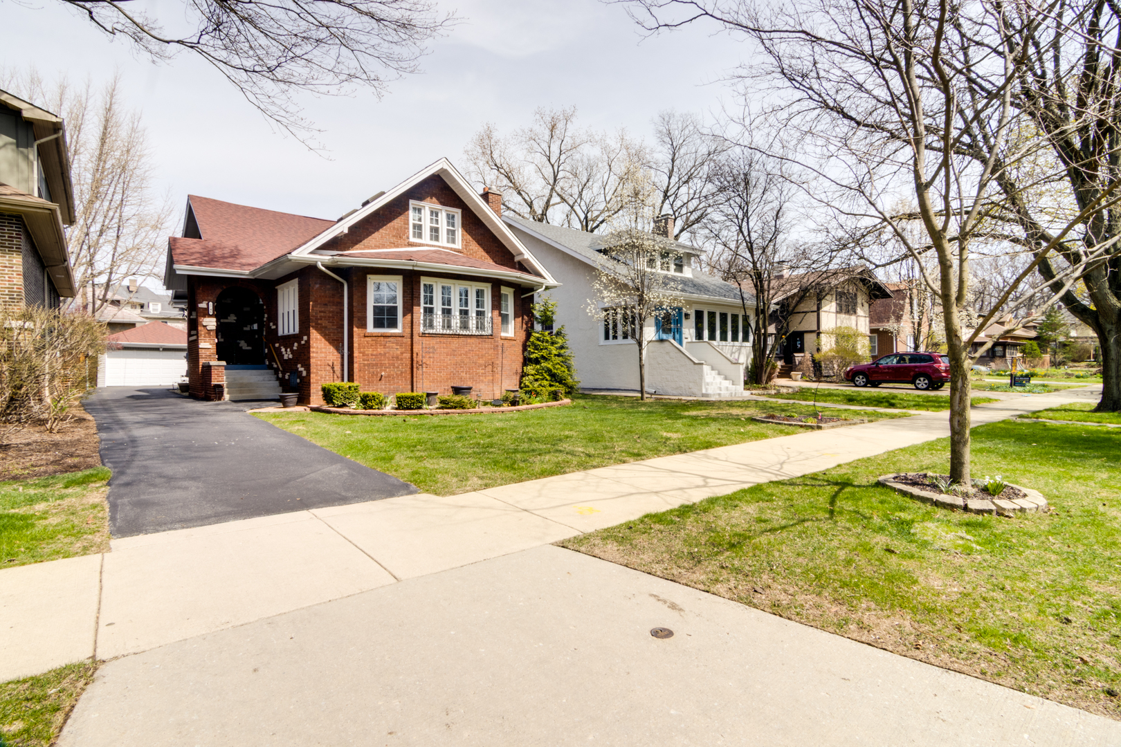 1746 West 104th Place Chicago, IL 60643 - Photo 3 of 58 a front view of a house with a yard and garage