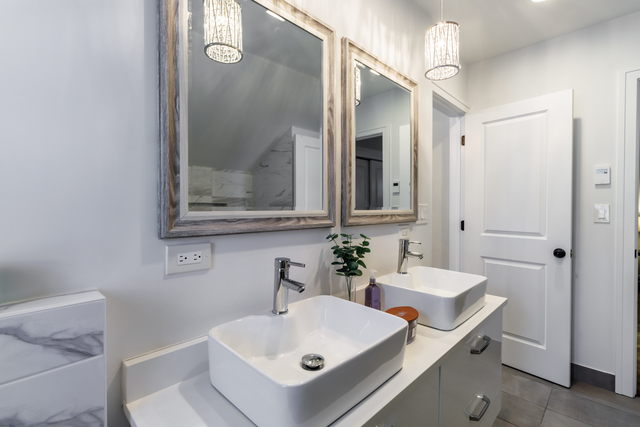 1746 West 104th Place Chicago, IL 60643 - Photo 34 of 58 a bathroom with a sink and a mirror