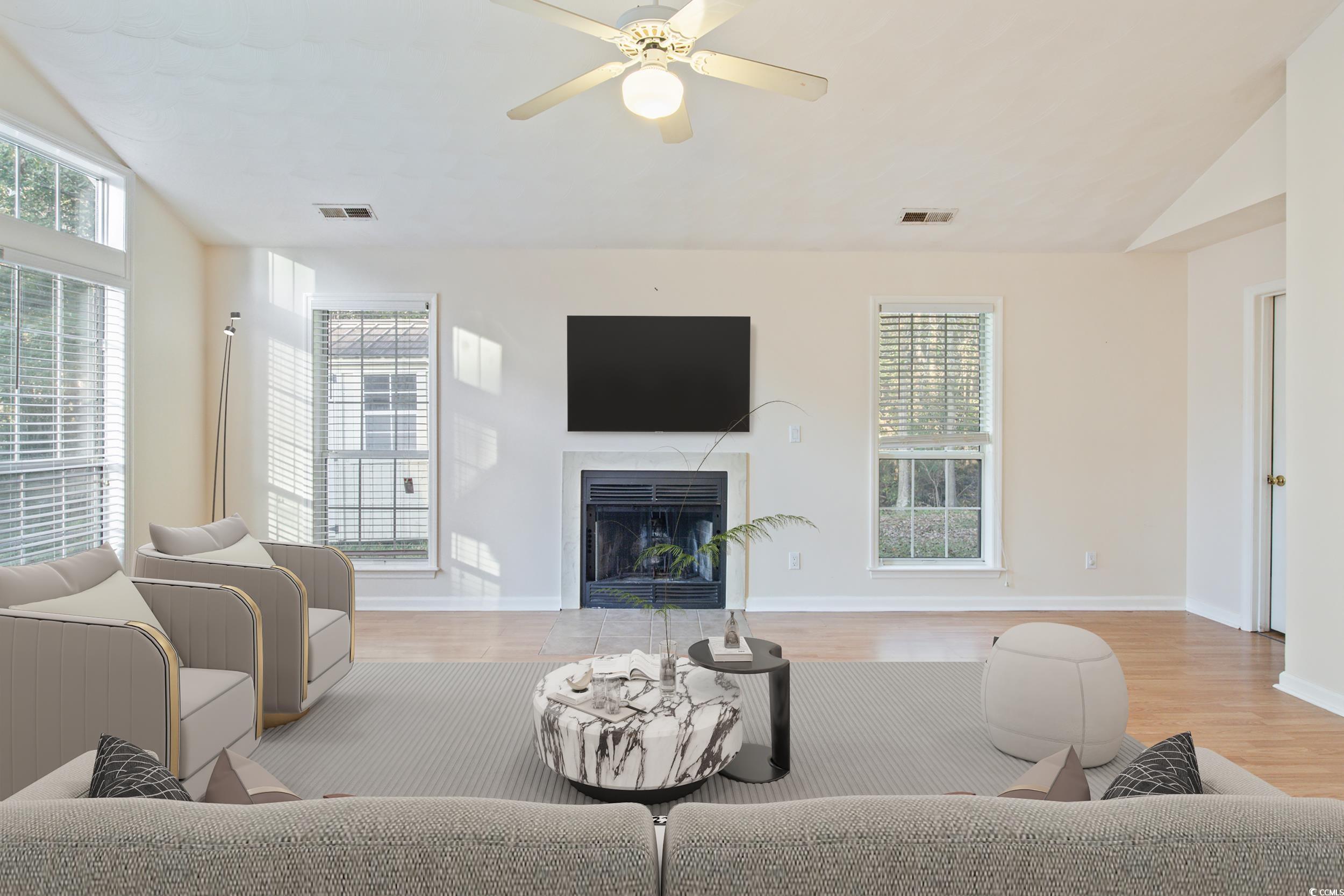 217 Nature Trail Little River, SC 29566 - Photo 12 of 37 Living room featuring vaulted ceiling, light hardw