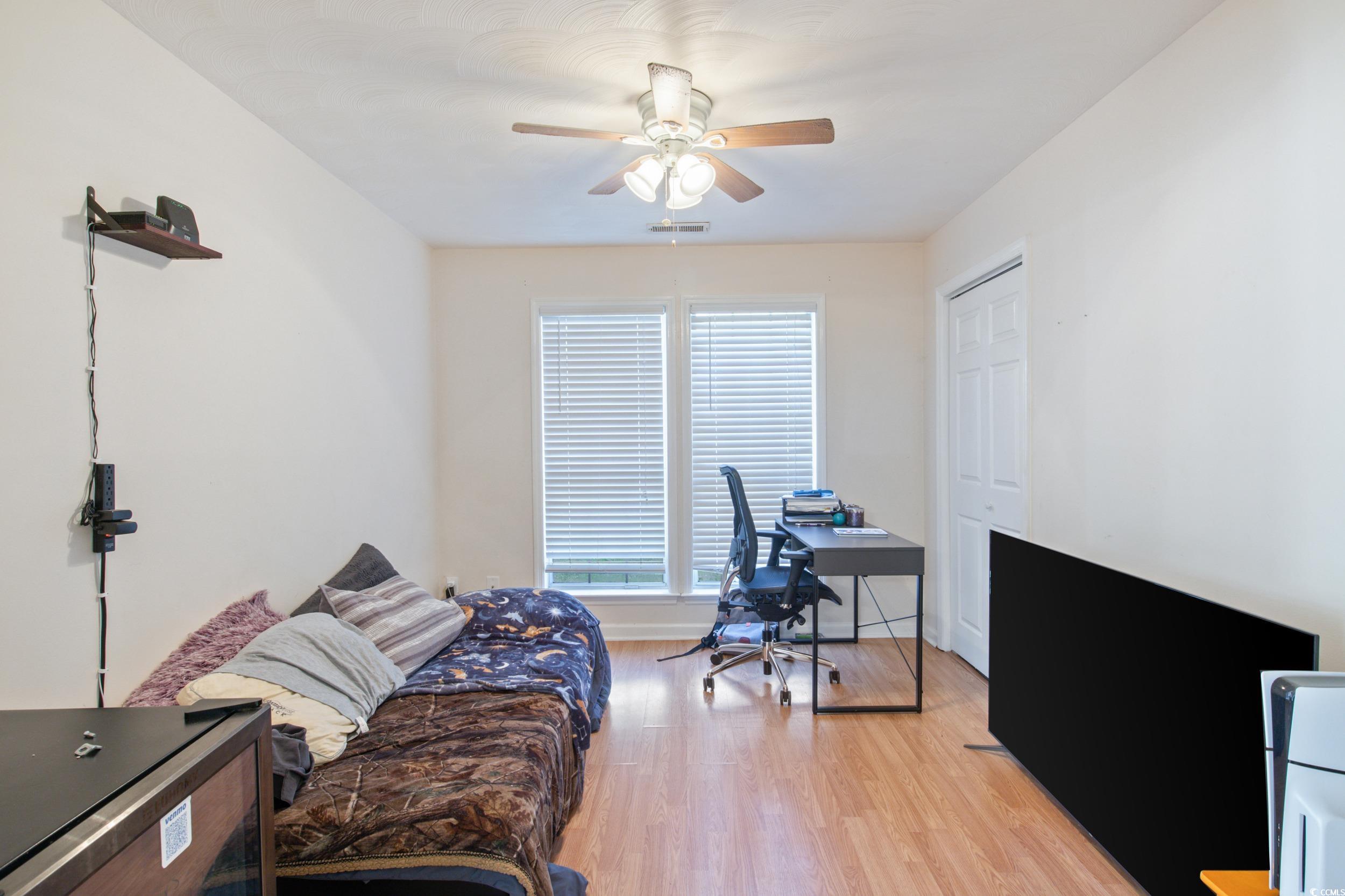 217 Nature Trail Little River, SC 29566 - Photo 25 of 37 wood-style floors and ceiling fan