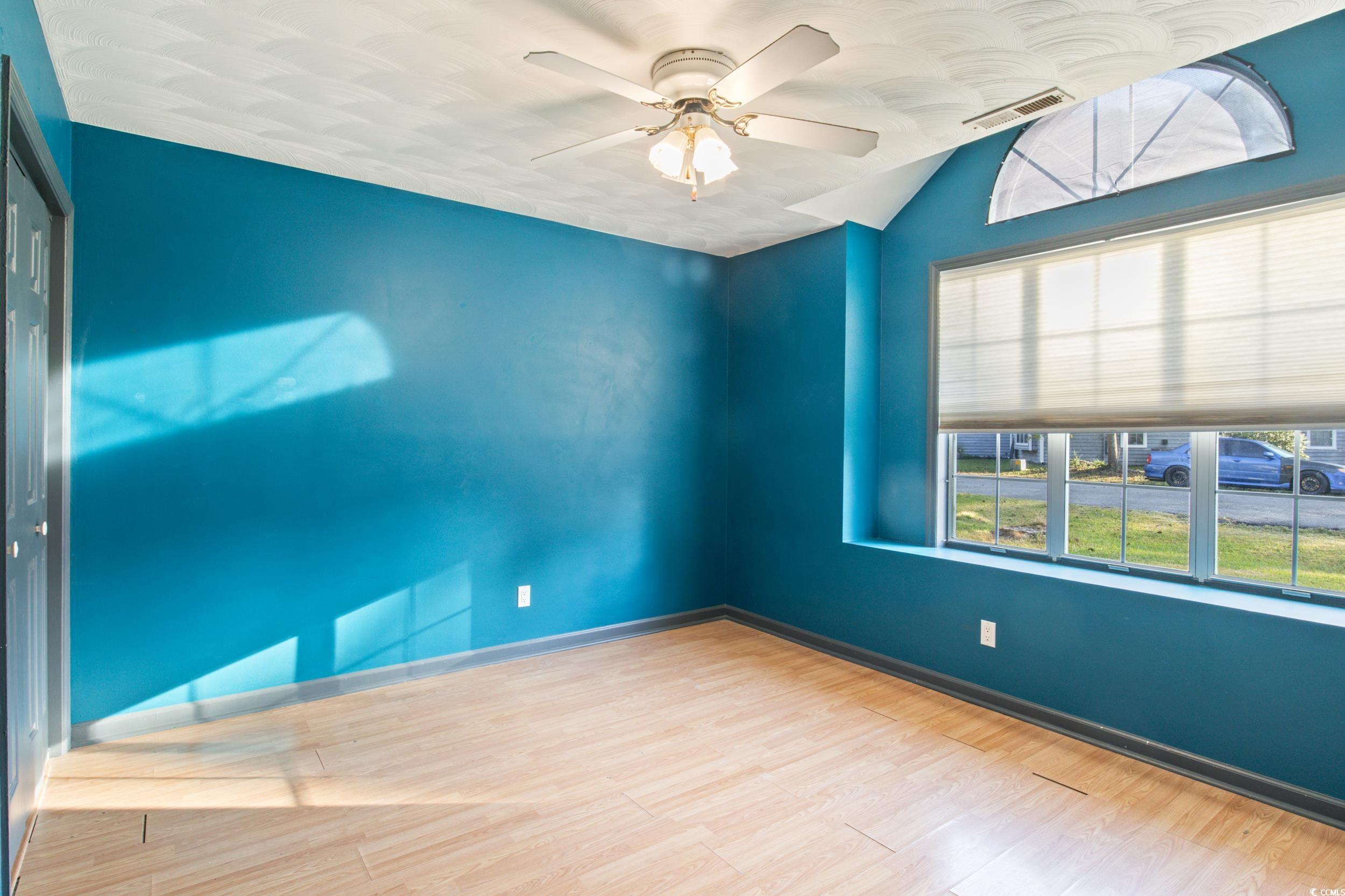 217 Nature Trail Little River, SC 29566 - Photo 27 of 37 Unfurnished room featuring lofted ceiling, light h