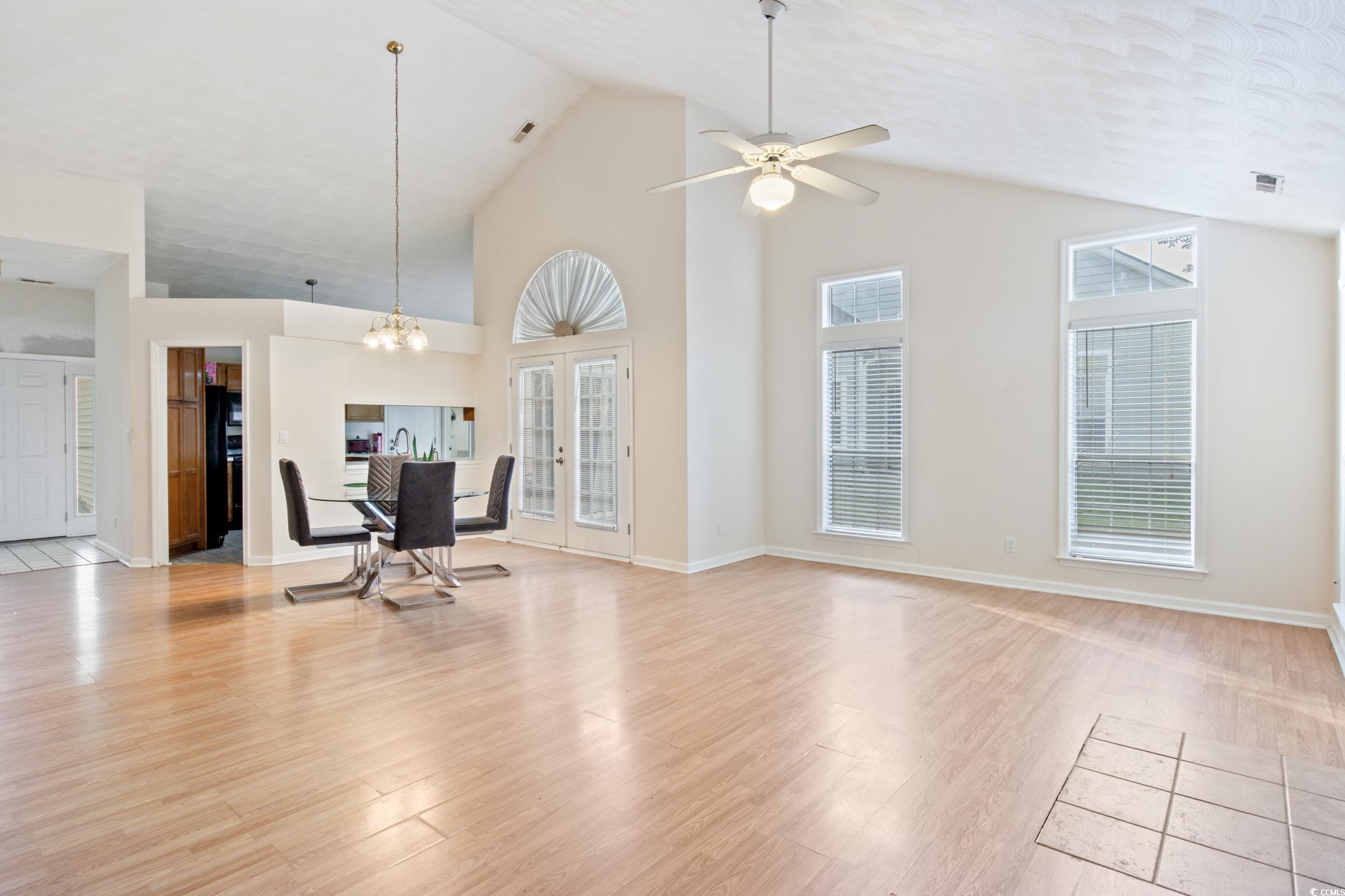 217 Nature Trail Little River, SC 29566 - Photo 7 of 37 Unfurnished living room with ceiling fan with nota