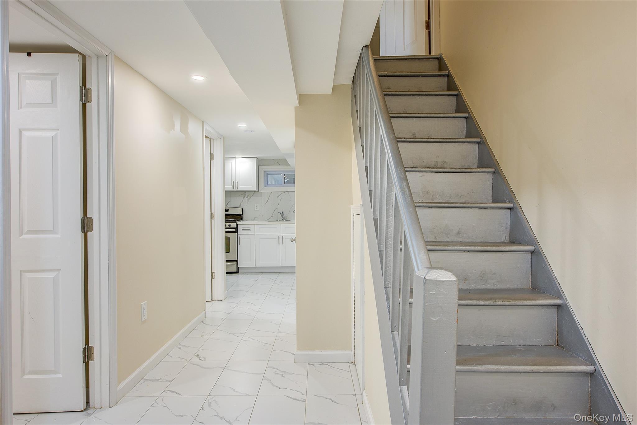 164-38 76th Road Queens, NY 11366 - Photo 26 of 44 a view of entryway and hall with wooden floor