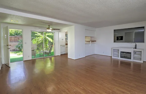 a view of livingroom with furniture window and wooden floor